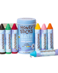 Honeysticks bath crayons set with a tin on a white background
